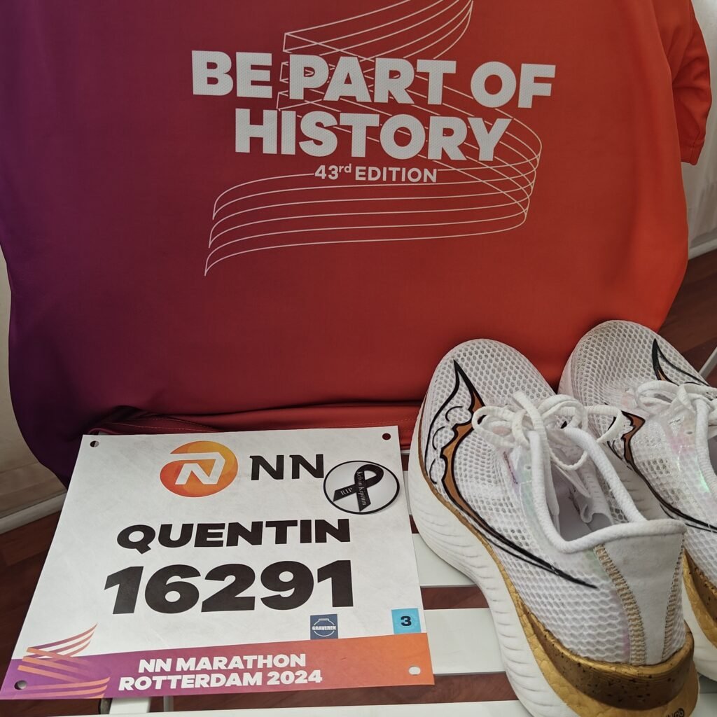 My marathon race bib and running shoes laid out before the 2024 Rotterdam Marathon.