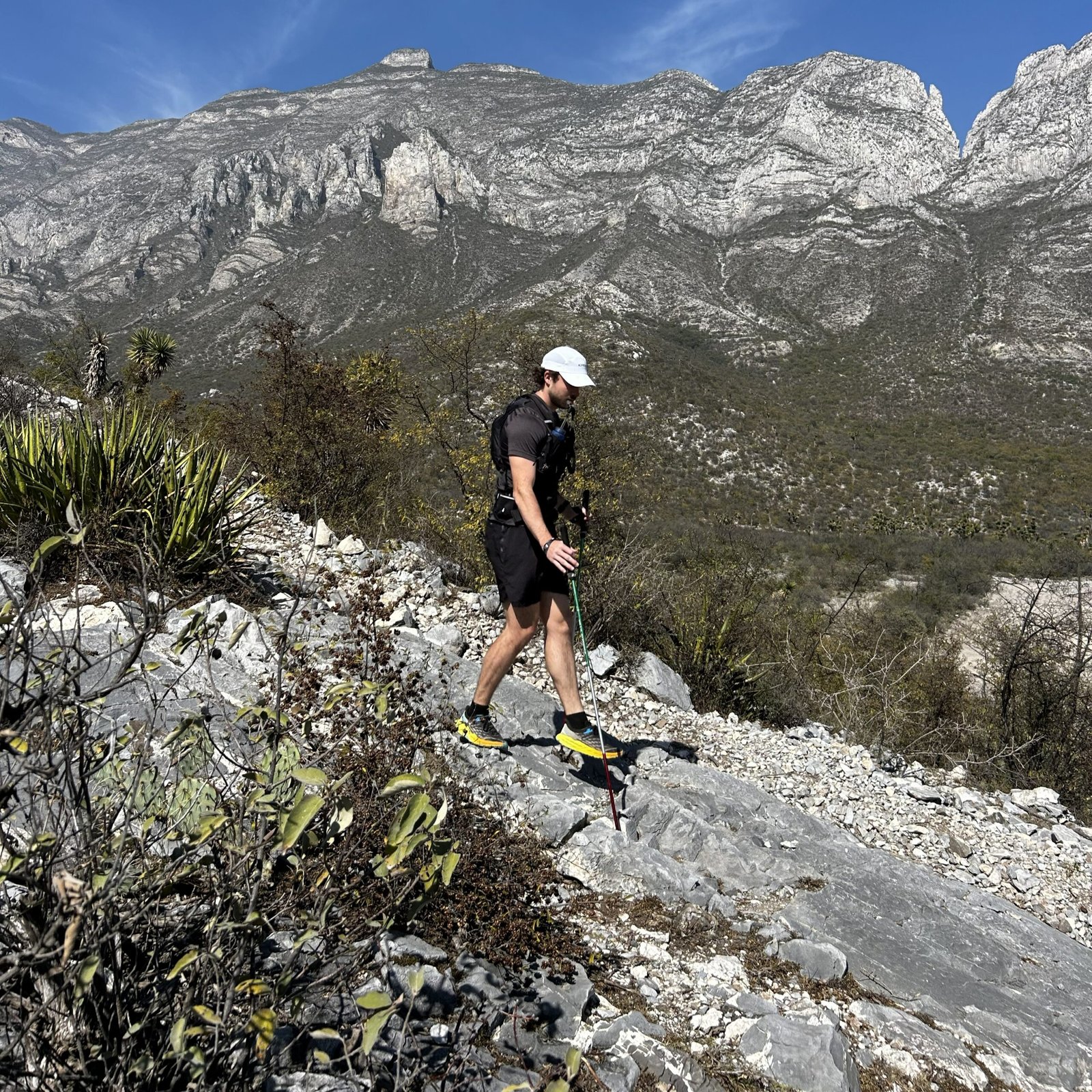 Runner descending a hill outdoors on a road